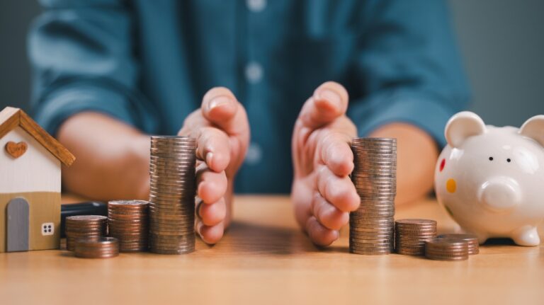 money and house being split by two hands