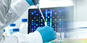 A person in a lab coat holds a pipette, preparing to conduct an experiment in a laboratory setting.