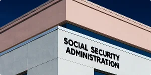 Image of the Social Security Administration building, featuring a modern architectural design and the agency's logo prominently displayed.