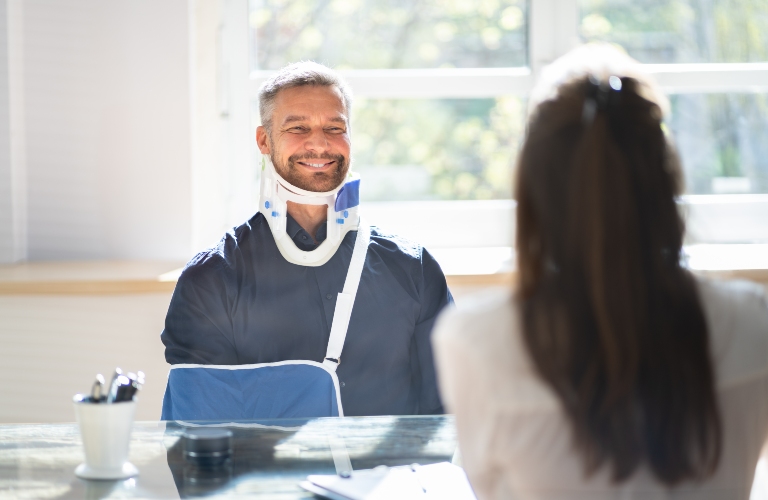 injured man consults with lawyer