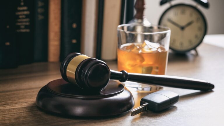 judge's gavel, alcohol and car keys