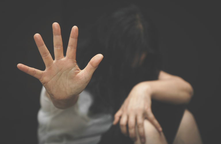 woman raised her hand to stop violence