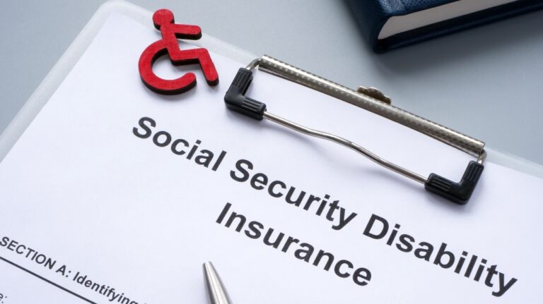 Clipboard with Social Security Disability Insurance SSDI policy