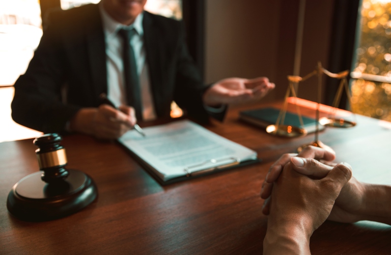 Lawyer is providing information about the client's trial at the lawyer office