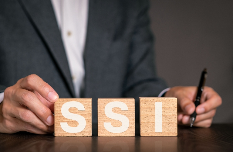 There is wood cube with the word SSI