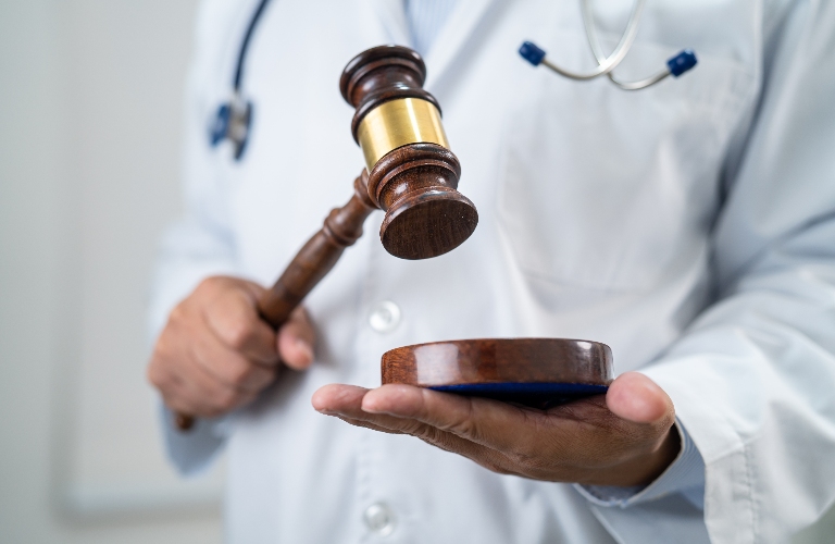 Doctor holding judge gavel