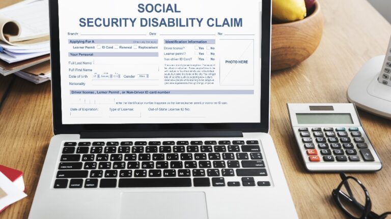 social security disability claim is opened on the laptop