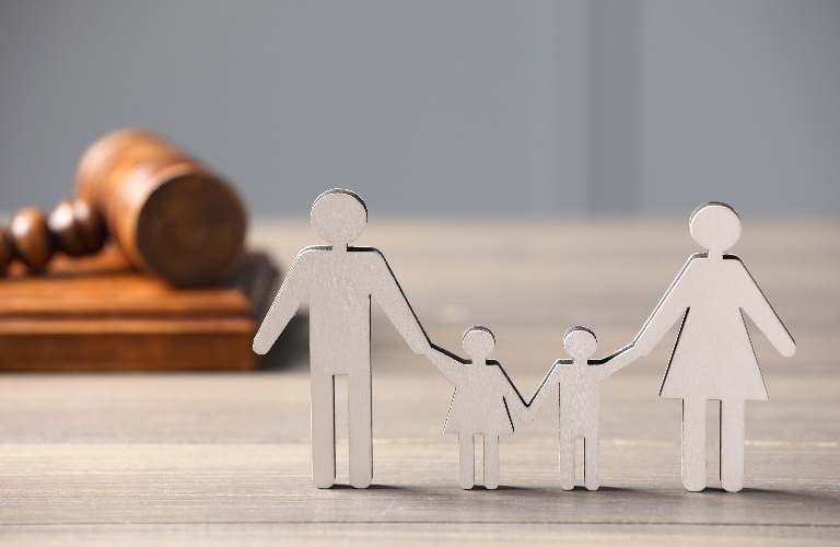 Figure of parents with children and gavel