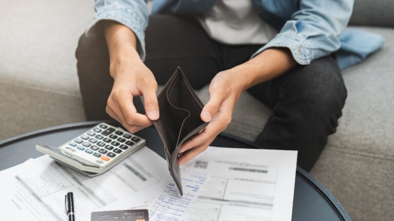 man opens empty wallet