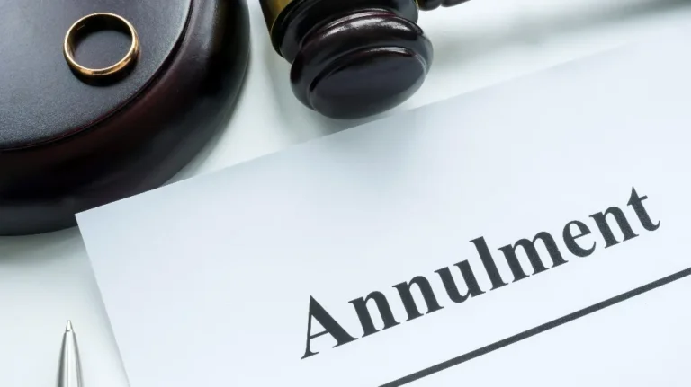 Close-up of a gold ring, judge’s gavel, and paper with “Annulment” text.